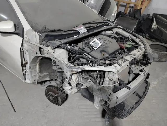 Front-end collision damage stripped back for repair